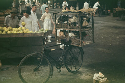 Seoul a bike and a fruit stand at a market place