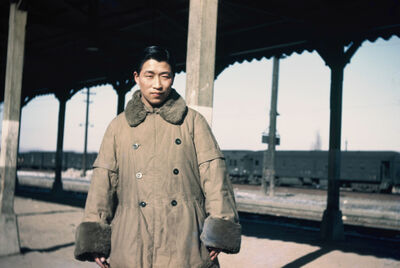 Seoul a man wearing a coat at a station
