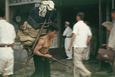 Seoul a man with an A-frame carrier on his back